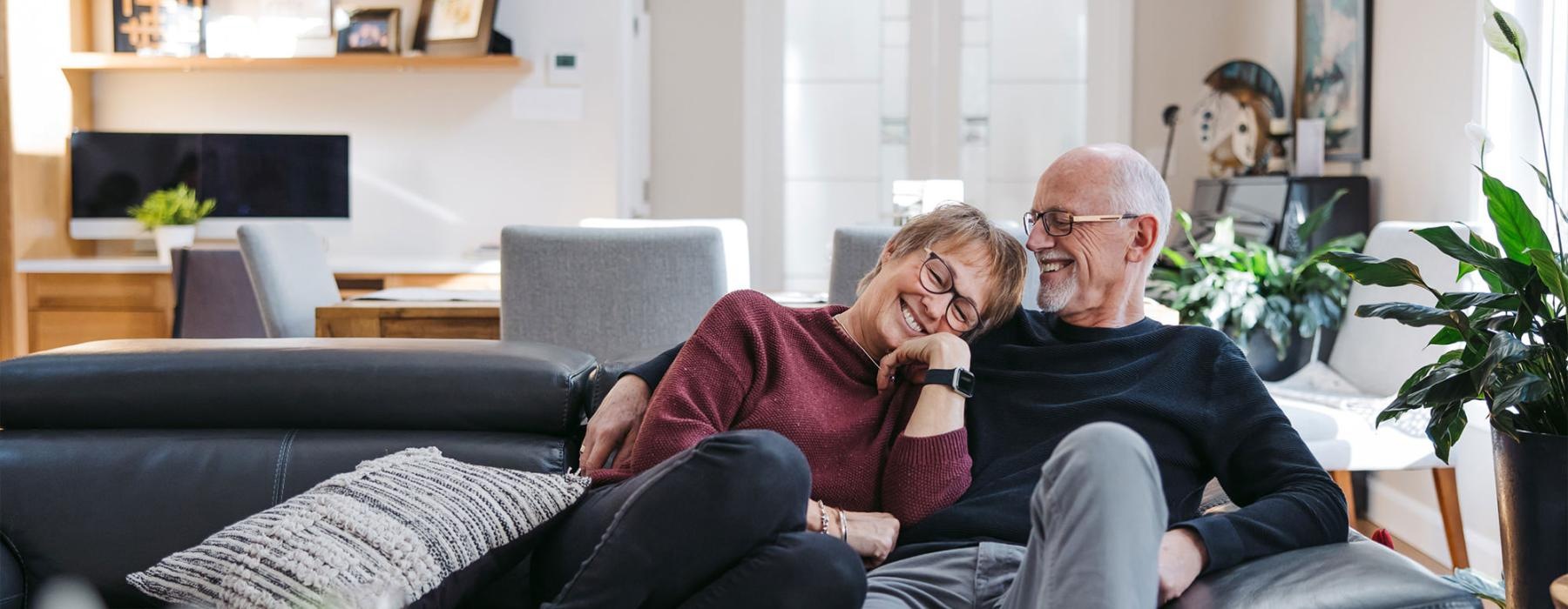 a man and woman sitting on a couch